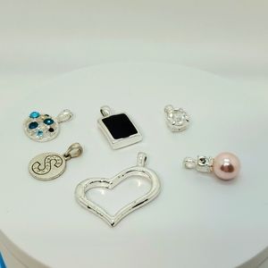 Assorted silvertone pendants